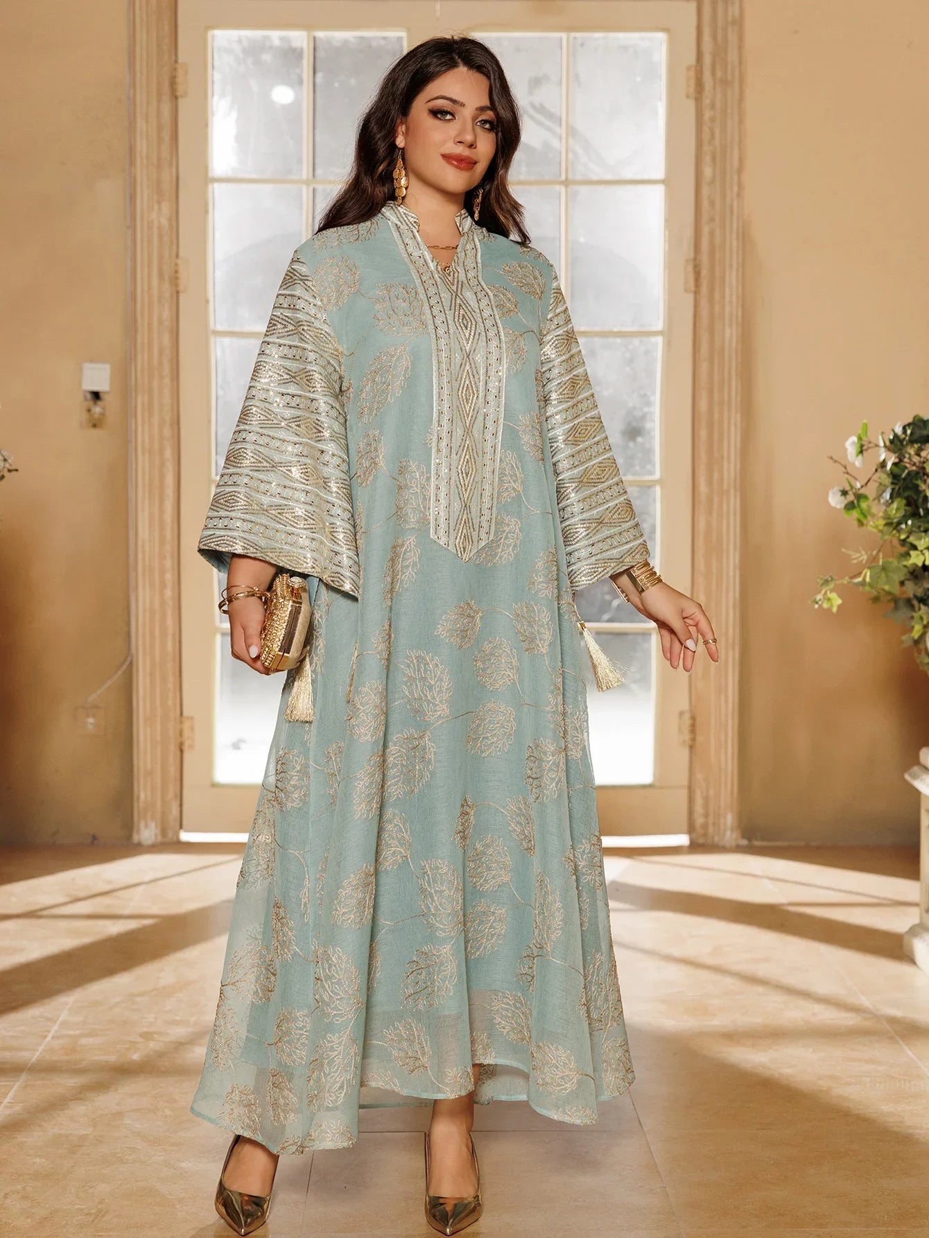 Elegant Light Green Abaya for Islamic Ladies Intricate Gold Embroidery and Tassel Accents Perfect for Festivities in Middle East