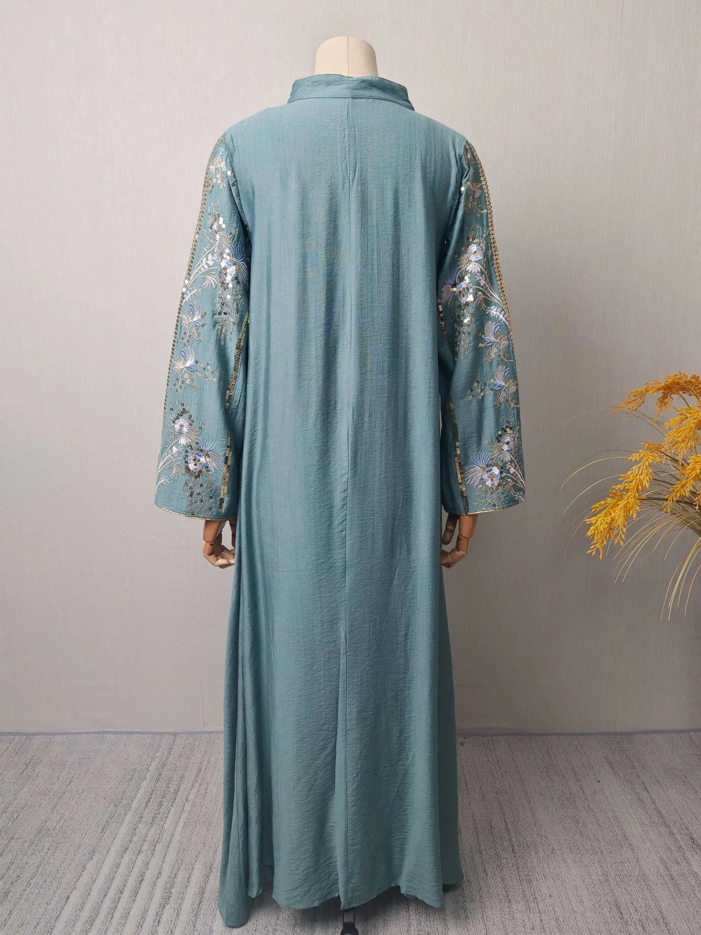 Black Muslim Abaya with Stand-Collar V-Neck Exquisite Blue-White Floral Embroidery Gold Accents Ideal for Ramadan Gatherings