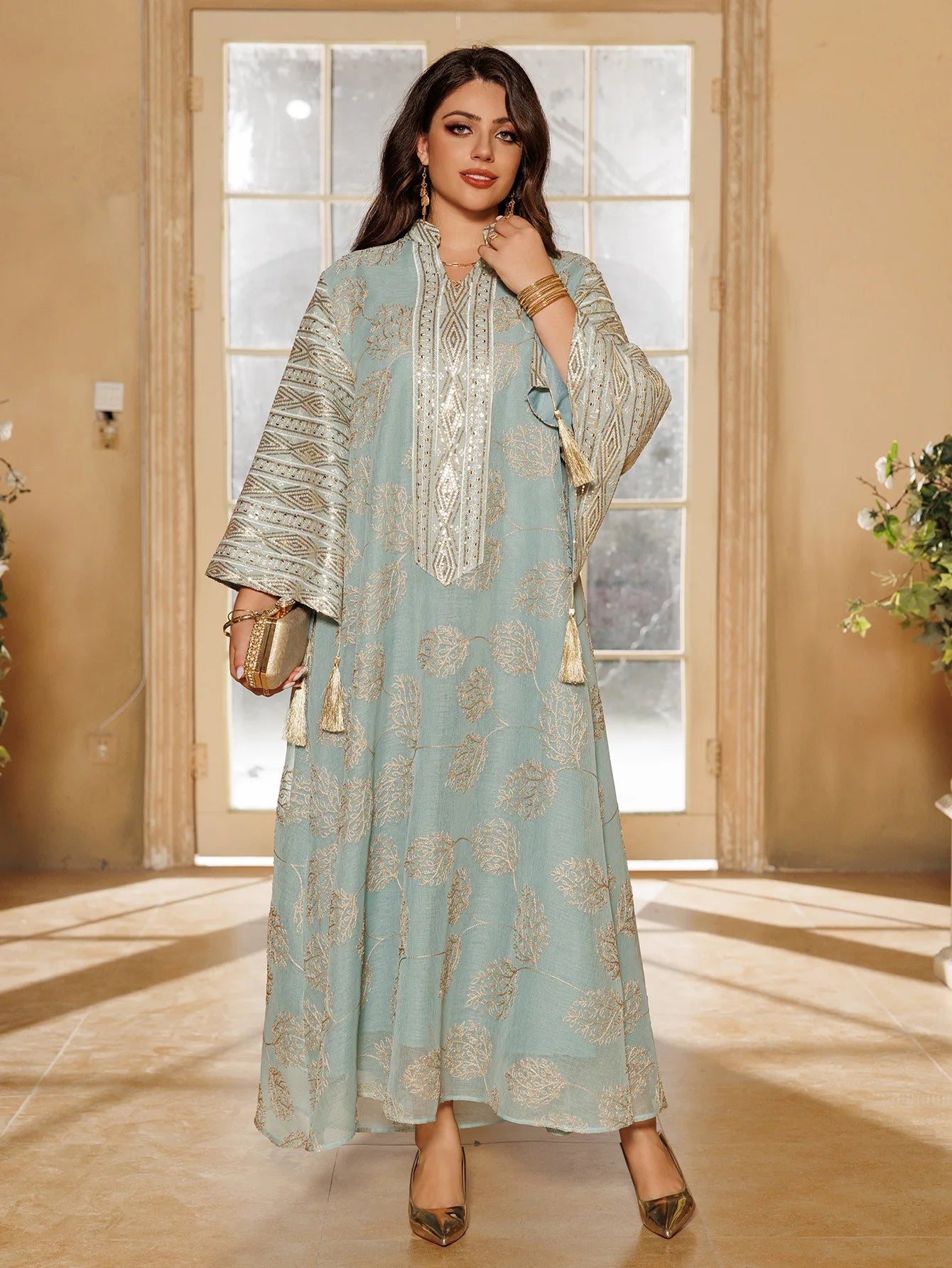 Elegant Light Green Abaya for Islamic Ladies Intricate Gold Embroidery and Tassel Accents Perfect for Festivities in Middle East