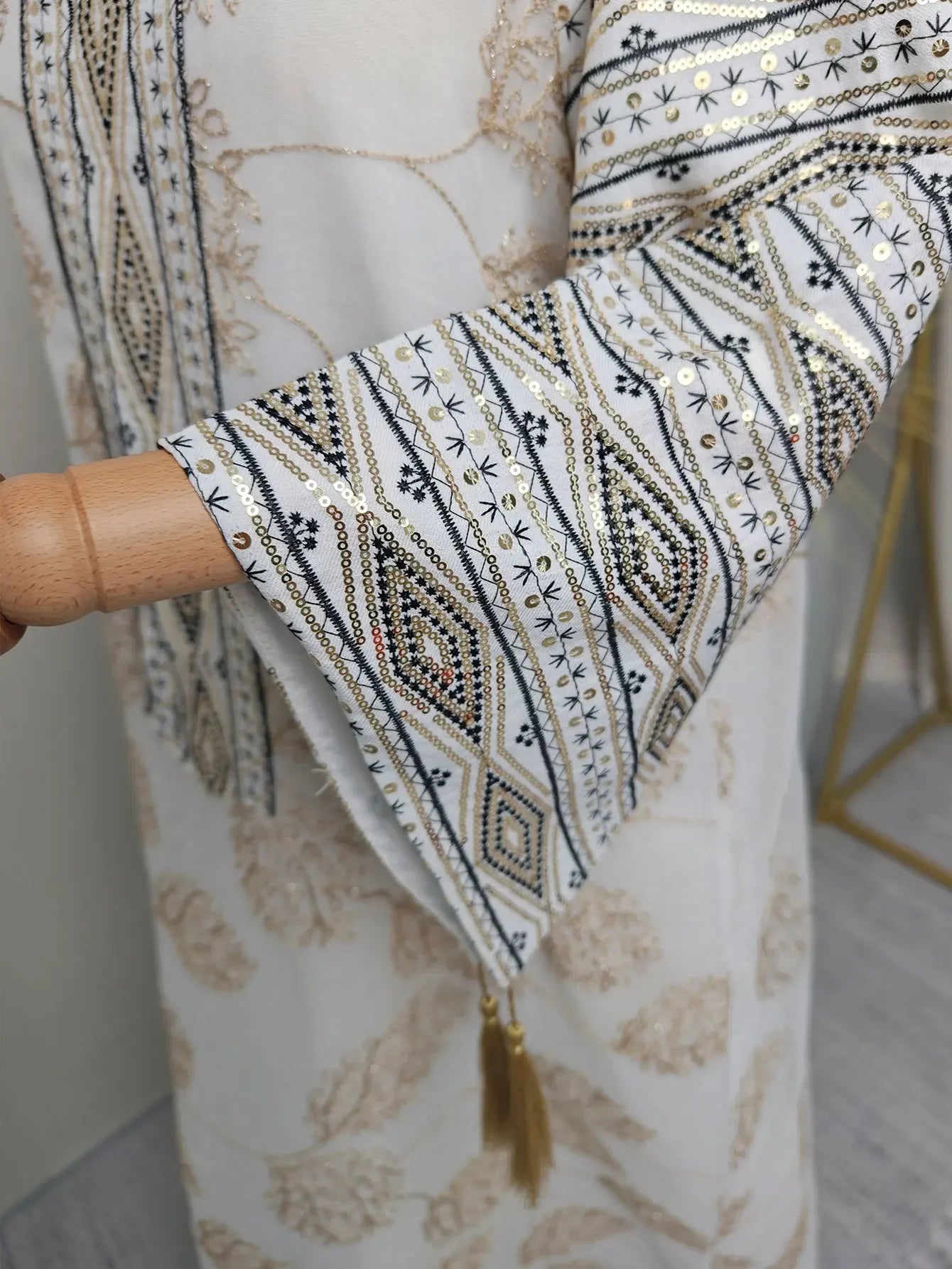 Elegant Light Green Abaya for Islamic Ladies Intricate Gold Embroidery and Tassel Accents Perfect for Festivities in Middle East
