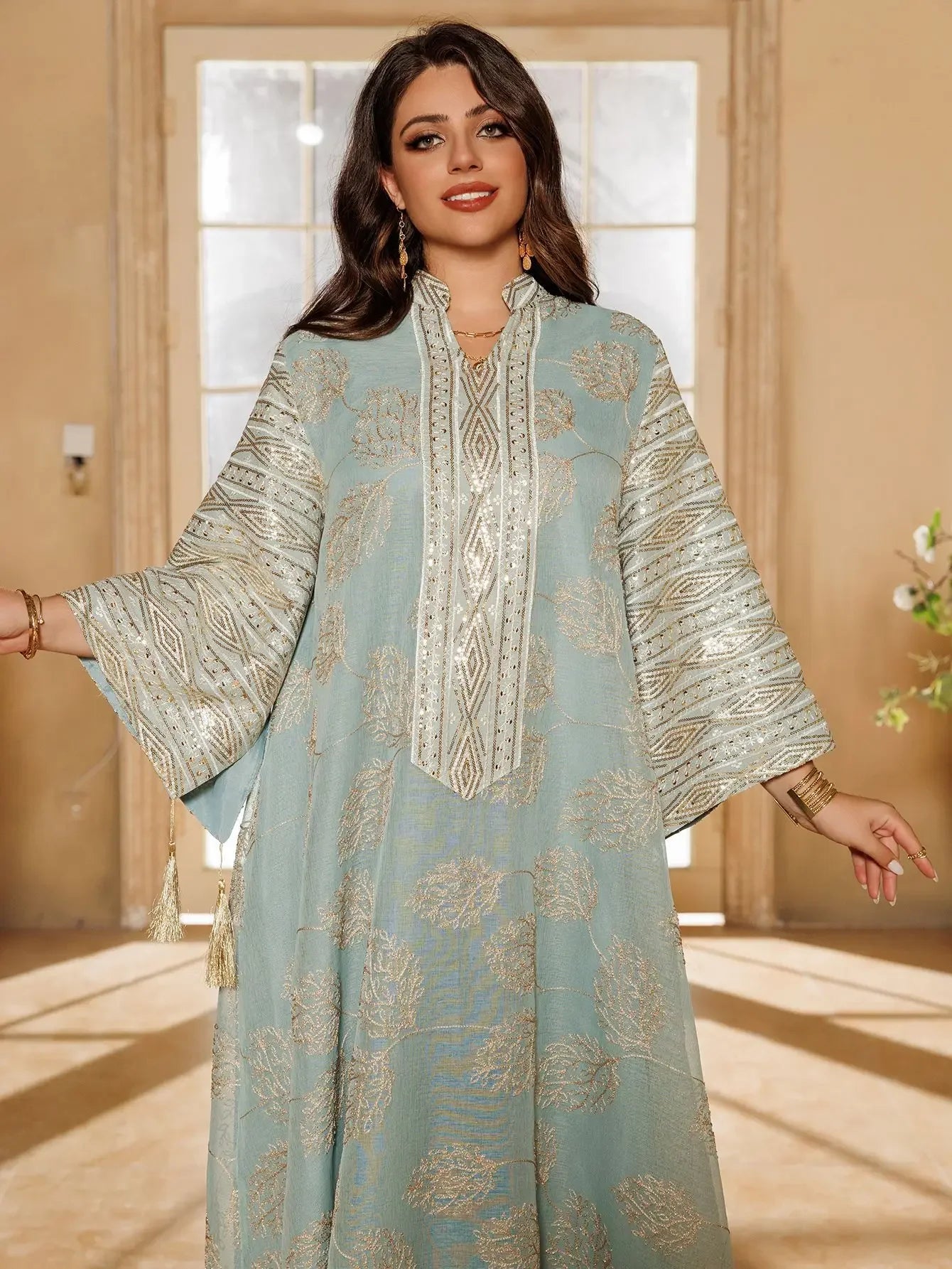 Elegant Light Green Abaya for Islamic Ladies Intricate Gold Embroidery and Tassel Accents Perfect for Festivities in Middle East