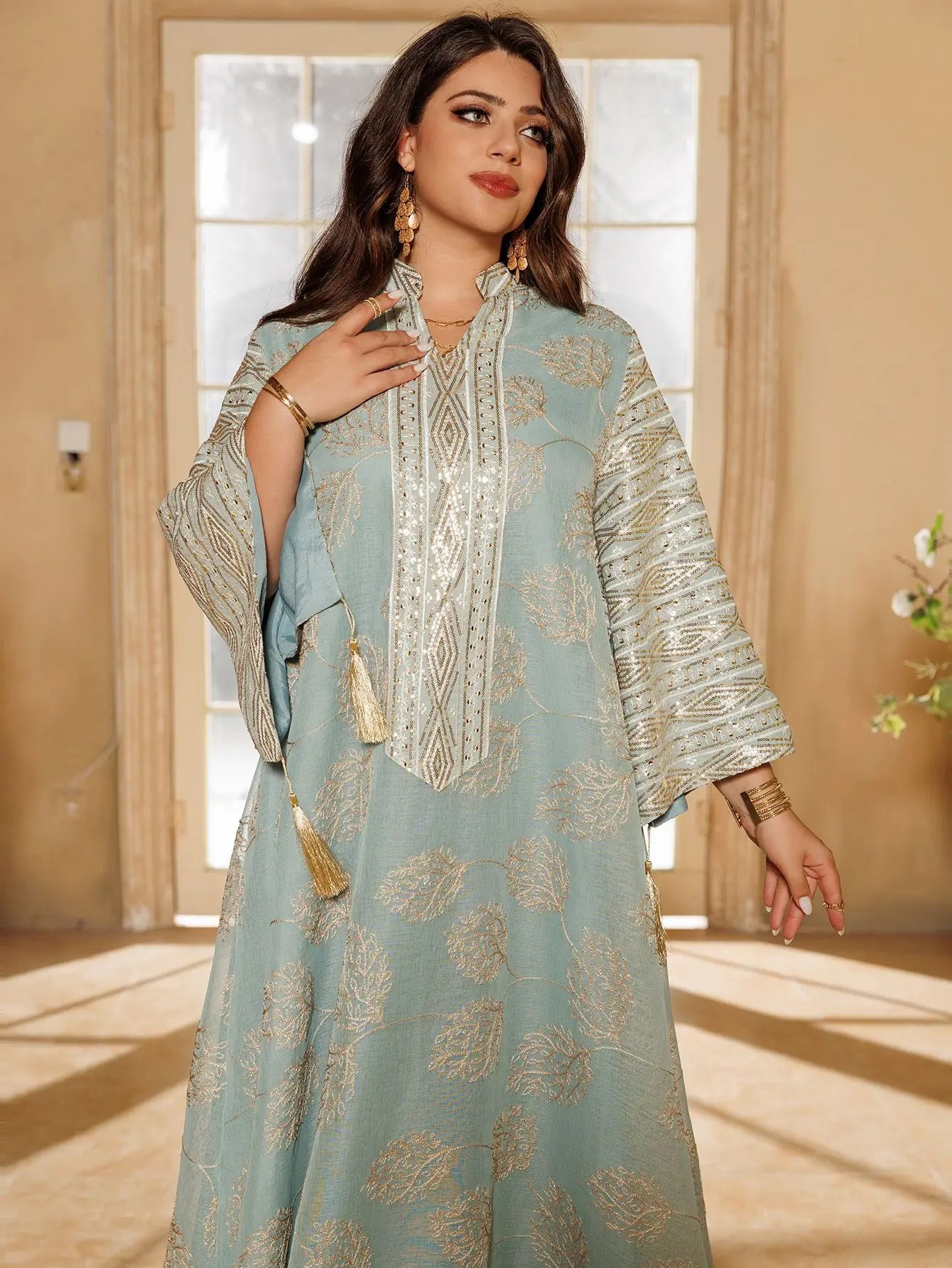 Elegant Light Green Abaya for Islamic Ladies Intricate Gold Embroidery and Tassel Accents Perfect for Festivities in Middle East